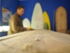 Keith making a surfboard out of gathered Agave wood.